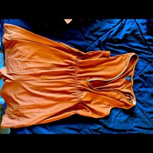 Orange front zipper romper.